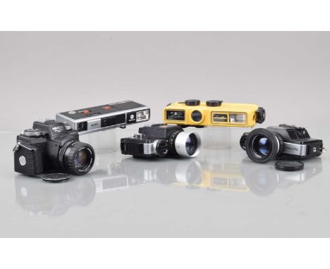 A Group of Minolta 110 Cameras, two 110 Zoom SLR, shutters working, meters responsive, a 110 Zoom SLR Mark II, shutter workin