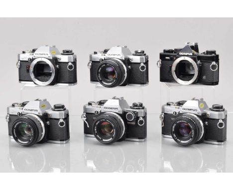 Six Olympus OM SLR Cameras, three OM-10, one with manual adapter, shutters working, meters responsive, self timers working, a