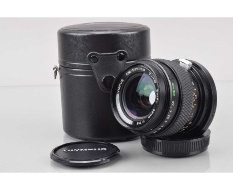 An Olympus OM Zuiko 35mm f/2.8 Shift Lens, shift moves freely, barrel G, light wear, elements G-VG, with front and rear caps,