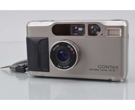 A Contax T2 Compact Camera, lens jumping when in manual focus, shutter working, meter responsive, self timer working, data ba