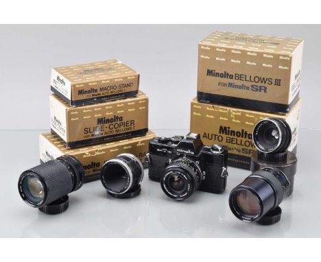 A Minolta SRT 101 SLR Camera and Accessories, black, shutter working, meter responsive, self timer working, body G, slight br
