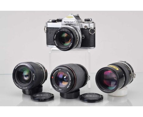 A Nikon FE SLR Camera, shutter working, meter responsive, responsive in auto, self timer working, some grime to focus screen,