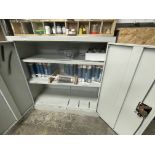 About 70 No tubes misc. mastic and a steel cupboard