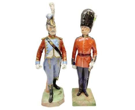 Two Napoleonic Dresden figures, comprising The Welsh Guards example and another in red coat in striding pose, with feathers t