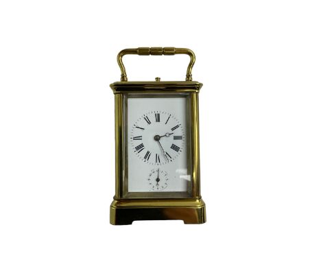 Late 19th century French carriage clock with a lever platform escapement, striking and alarm train and repeat button, in a gi