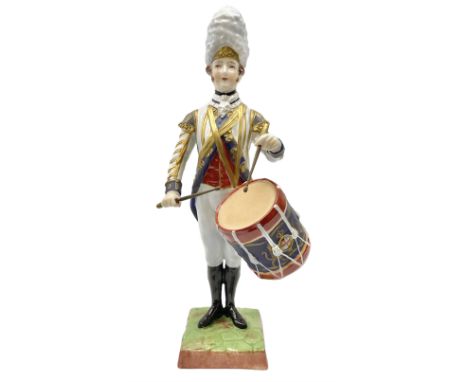 Dresden Drummer of the 3rd Guards figure, modelled playing drum standing to attention, his dress and headwear detailed with g