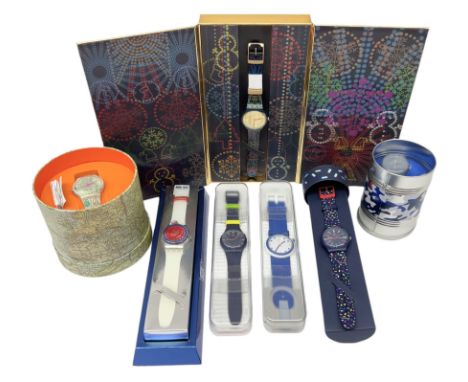 Seven Swatch quartz wristwatches including Celebration Time, POP, 25th Anniversary and World Map, all boxed and an Omega red 