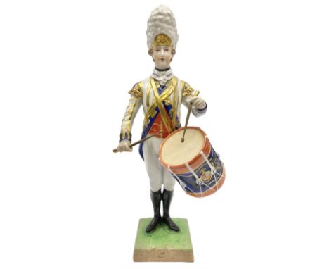 Dresden Drummer of the 3rd Guards figure, modelled playing drum standing to attention, his dress and headwear detailed with g