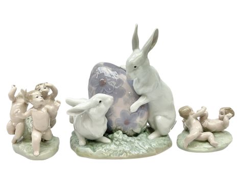 Three Lladro figures, comprising Easter Bunny no 5902,  Tumbling no 5805 and Playing Tag no 5806, two with original boxes, ta