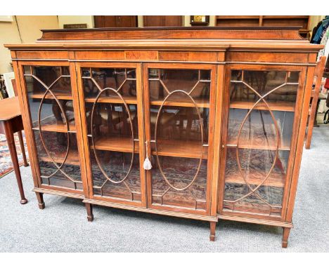 An Edwardian Glazed Mahogany Breakfront Bookcase, 183cm by 35cm by 132cmTop heavily faded, some fading to the left hand side.