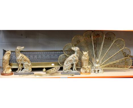 19th Century and Later Brass, including a pierced fender, a peacocks tail fire screen, chestnut roaster, pair of dog form chi