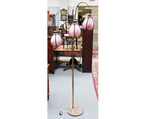A Brass Three Light Standard Lamp, with glass shades