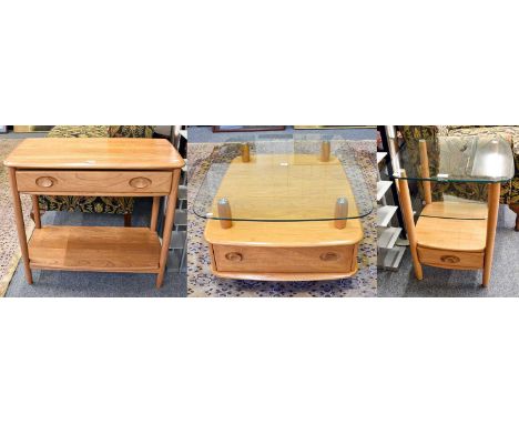 An Ercol Windsor Light Elm Finish Hall Table, 80cm by 41cm by 72cm, a matching glass topped two drawer coffee table, 103cm by