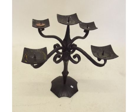 A wrought iron candlestick