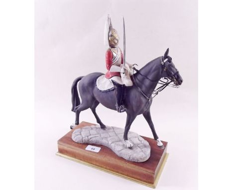 A porcelain figure of a horse guard made by David Fryer ex Royal Worcester porcelain (David Fryer was head of design at Royal