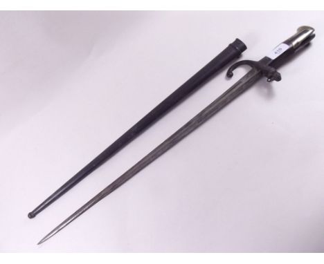 A 19th century French bayonet inscribed and dated 1876, with scabbard