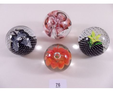 Four various paperweights including Caithness and Langham