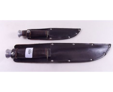 A wooden handled hunting knife in leather sheath and another similar smaller one