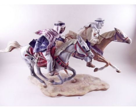 A large porcelain group of two arabs on horseback made by David Fryer ex employer of Royal Worcester Porcelain factory (David