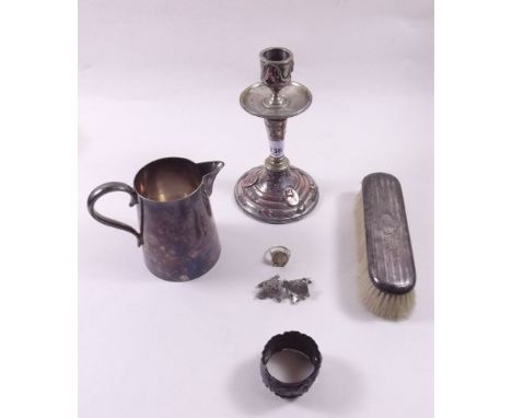 A silver backed brush, cufflinks and napkin rings plus a silver plated candlestick and jug