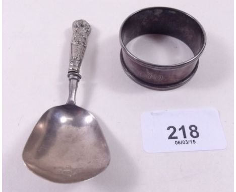 A silver caddy spoon Birmingham 1831, maker T & P and a silver napkin ring