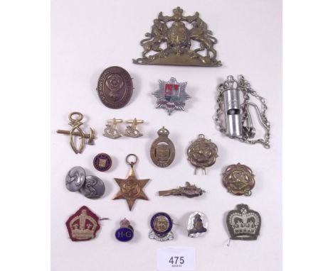 A box of military badges, helmet badge, enamel badges, whistle etc.