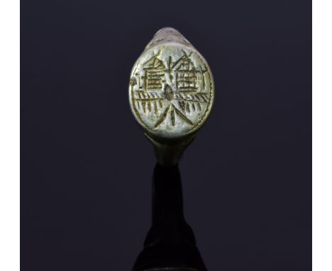 Interesting Medieval ring with stylized farm / houses depicted on the bezel; intact and well preserved band with decoration o