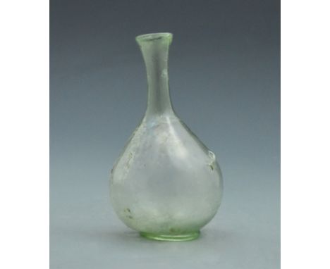 An interesting light green glass flask with long neck and pedestal base. - 160mm, 56 grams - ca.200AD - Property of a British