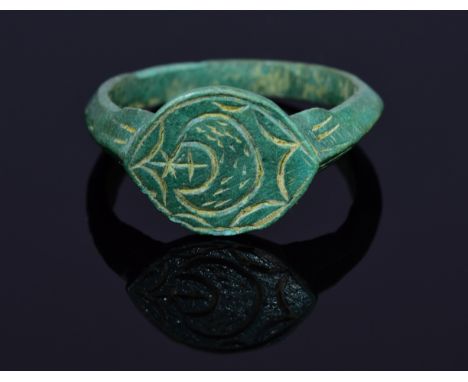 Rare Holy Land seal ring with moon crescent and sword depicted on bezel; intact, well preserved band. Possibly worn by a 13th