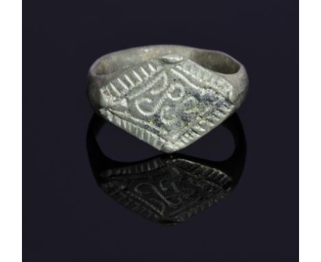 An interesting medieval ring with lozenge shaped bezel engraved with runic symbols. intact and well preserved band. Possibly 