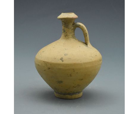 A light terracotta vessel in the form of a drinking flagon with single handle and everted rim to the top the neck. - 160x125m
