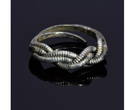 A substantial Viking Scandinavian silver twisted ring with remains of gold gilding; open-work band and very elaborate knot/tw