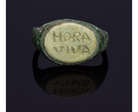 An interesting Roman soldier's ring with large inscribed gem in bezel; intact, well-preserved D-shaped bezel. The inscription