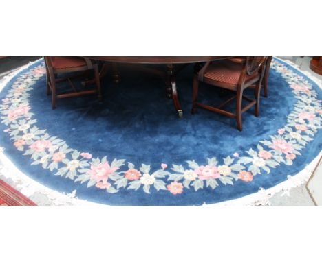 A large circular blue ground Chinese carpet