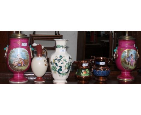 A pair of 19th century continental porcelain vases painted with figures in landscapes together with copper austere jugs, Maso