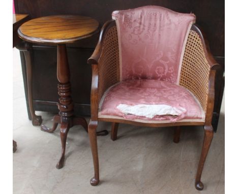 A small tripod table together with a bergère chair