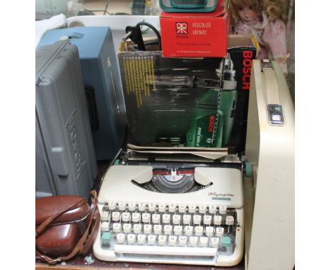 An Olympia splendid 66 typewriter together with tools, camera etc