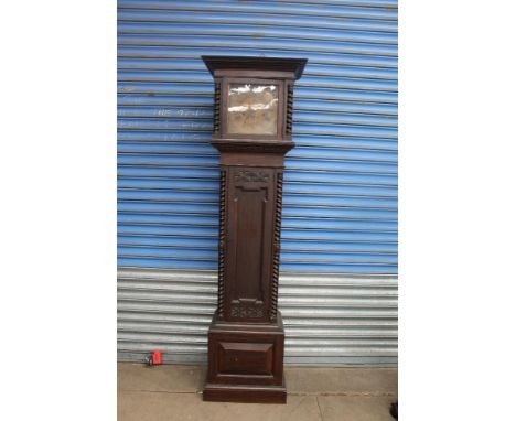 A Warings and Gillows oak long case clock, with a brass dial and three train movement