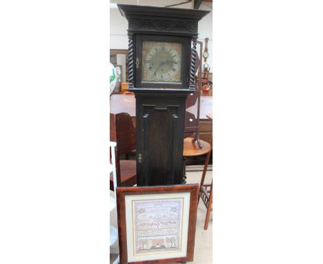 An oak cased Grandmother clock, with a silvered dial and Roman numerals together with a fire screen