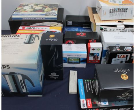 A collection of new and used boxed appliances  including an home theatre system together with a telephone, cordless telephone