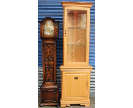 A 20th century oak grandmother clock together with a modern corner cupboard