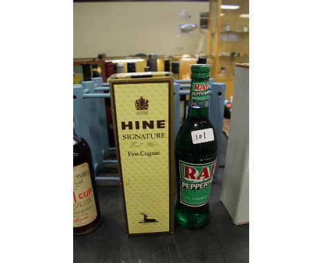 Bottle of Hine Signature Fine Cognac and a bottle of RAF Peppermint Liqueur