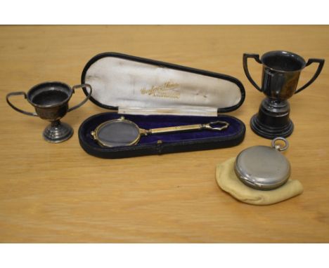 A cased pair of yellow metal lorgnettes, two silver plated miniature trophies, the largest measuring 8cm high, and an early 2