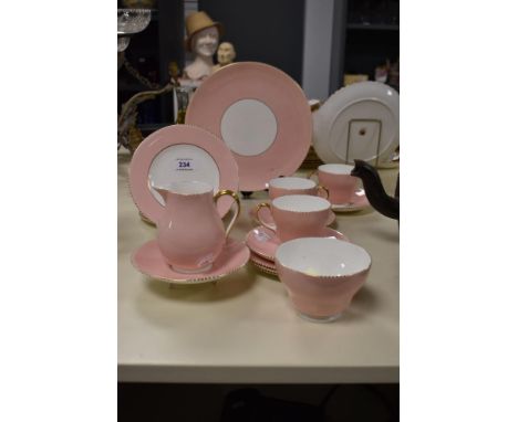 A small quantity of Wedgwood tea ware in the April Pink pattern, to include teacups and saucers, milk jug, and sucrier
very n