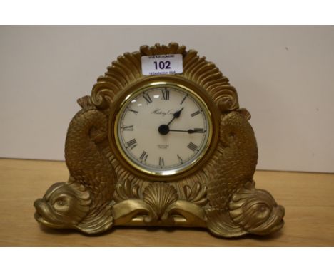 A reproduction History Craft battery operated mantel clock, in the Victorian style with gilt resin case, measuring 18cm high