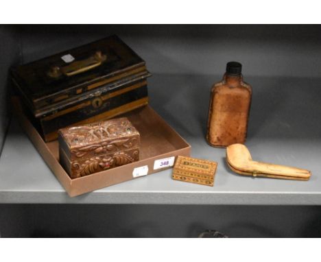 A vintage painted metal cash box, leather covered glass bottle, cased pipe, inlaid stamp box and wooden playing card case for