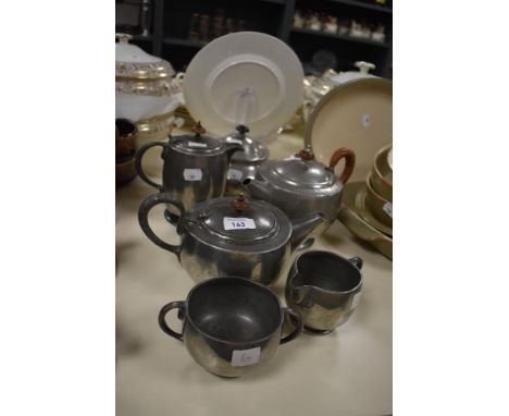 An Arts and Crafts Tudric Pewter teapot, measuring 16cm high, and a selection of other pewter ware by Liberty &amp; Co. And o