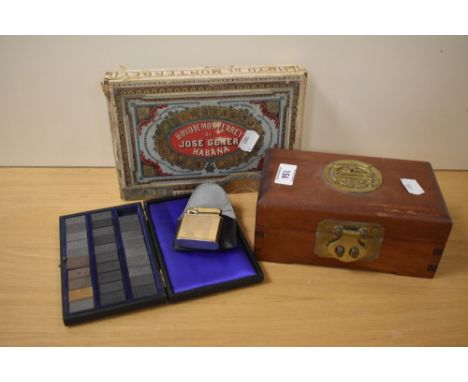 A 20th Century Chinese hardwood jewellery box, having applied brass motif to the lid and lined interior, measuring 8cm x 18cm