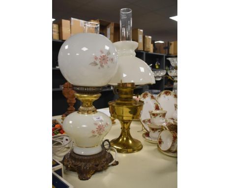 A mid-20th Century electrified Gone With The Wind Parlour lamp, measuring 50cm high, and a Victorian brass oil lamp with dome