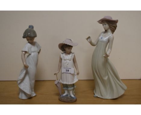 A Nao porcelain figural study, 'Gentle Breeze' with loss to the left hand thumb, measuring 27cm high, and two other smaller N